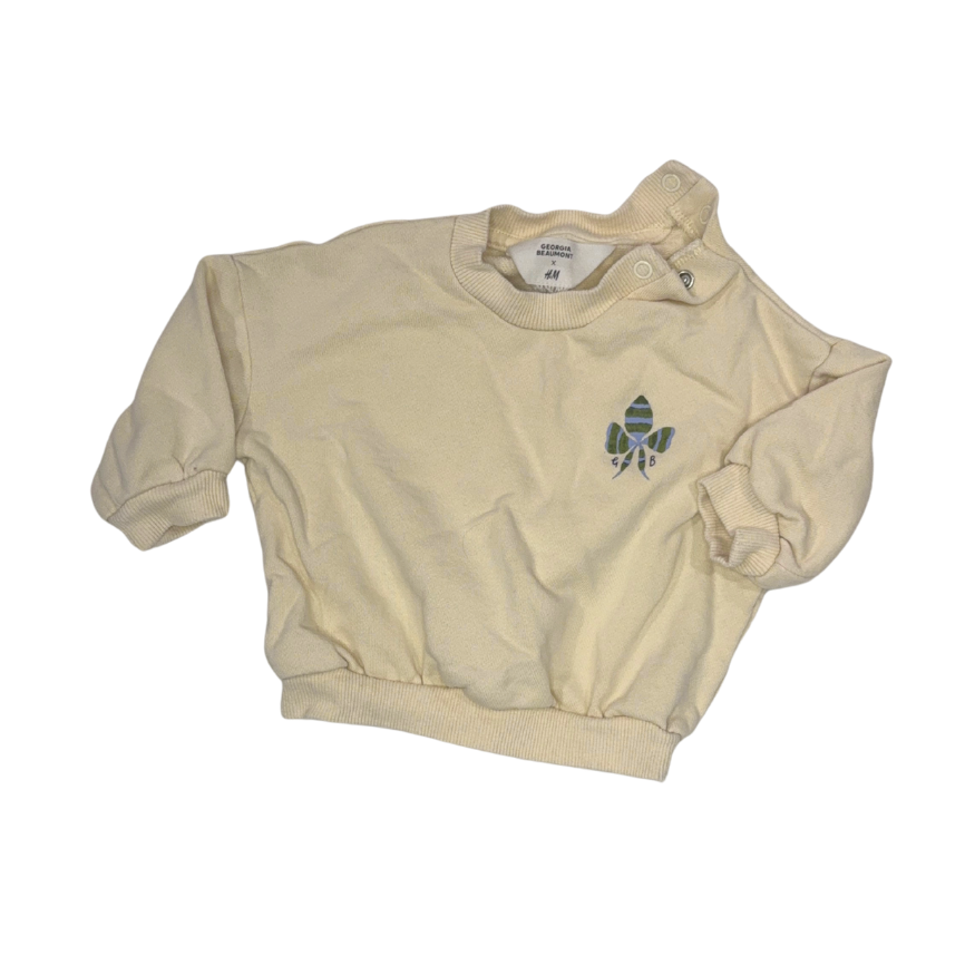 Light yellow sweatshirt with pattern on the back | 2-4M